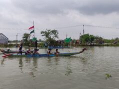 Moment Harlah NU, Belasan Tim Dayung Bersaing Adu Kecepatam di Kawasan Bengawan Jero